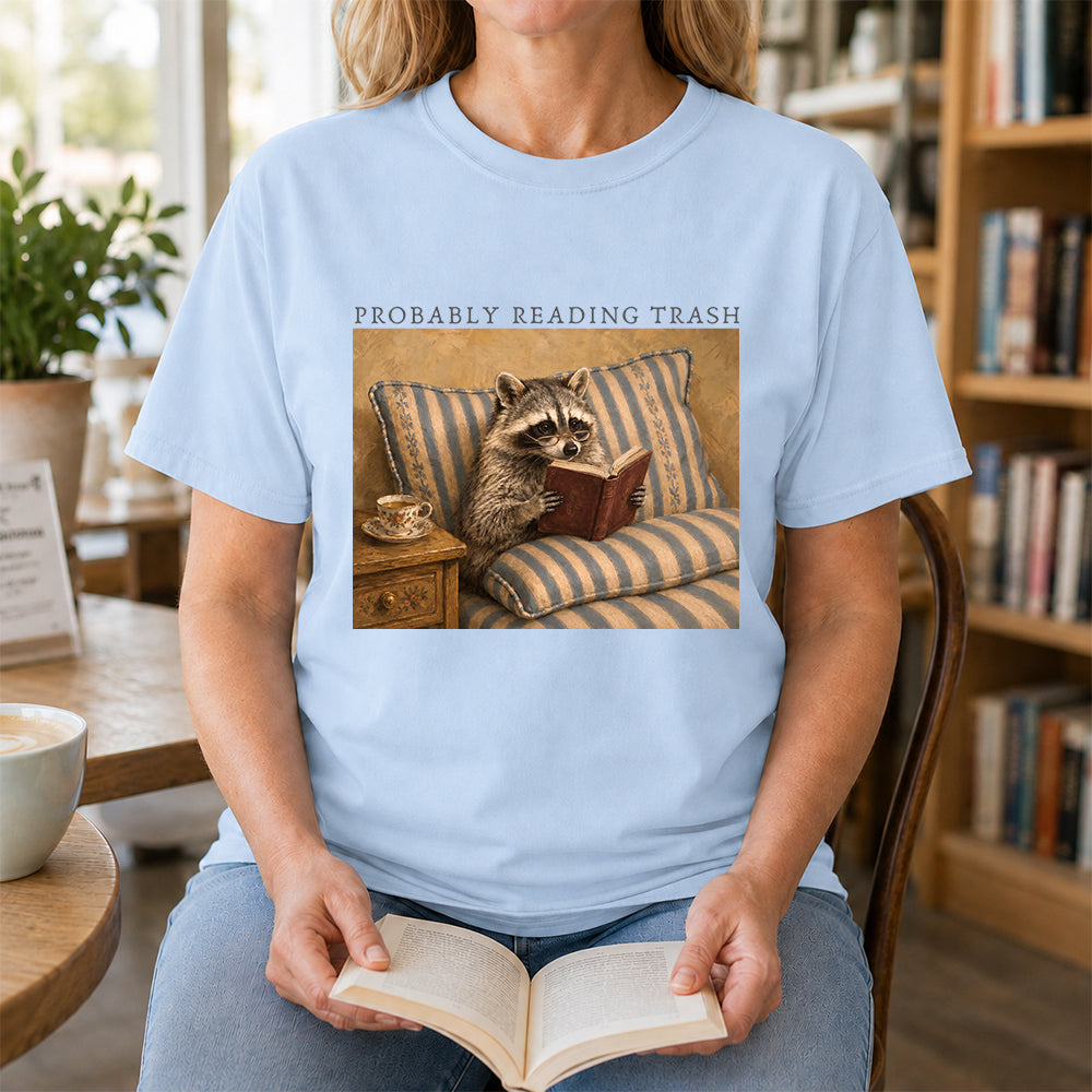 Probably Reading Trash Racoon Softstyle T-Shirt | Book Lover Gift Light Blue