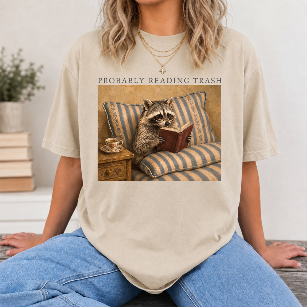 Probably Reading Trash Racoon Softstyle T-Shirt | Book Lover Gift Sand
